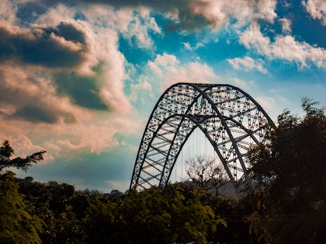 Stunning view of Adomi Bridge, Ghana with dramatic clouds in the backdrop, enhancing its architectural elegance.